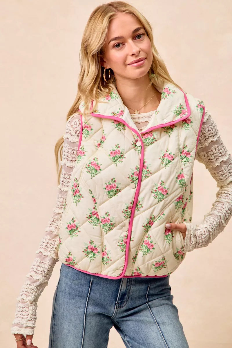 Cream and pink BiBi floral print quilted vest with piping detail from Trendsi, shown on a model.