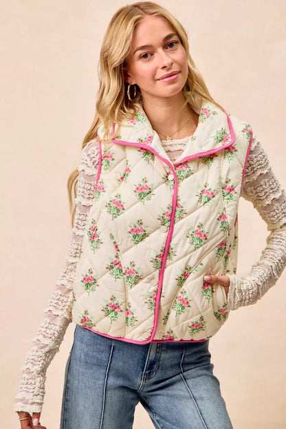 Cream and pink BiBi floral print quilted vest with piping detail from Trendsi, shown on a model.