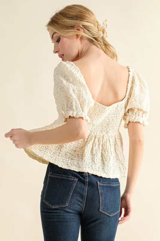 Cream textured and smocked top by Trendsi, featuring a stylish, fitted design with gathered details and a flattering neckline.