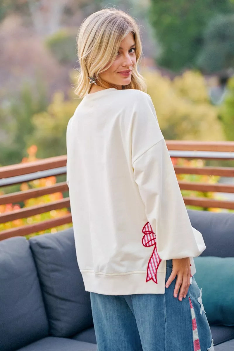 Cream sweatshirt with 4th of July stars and stripes patches by BiBi, featuring patriotic red, white, and blue design.