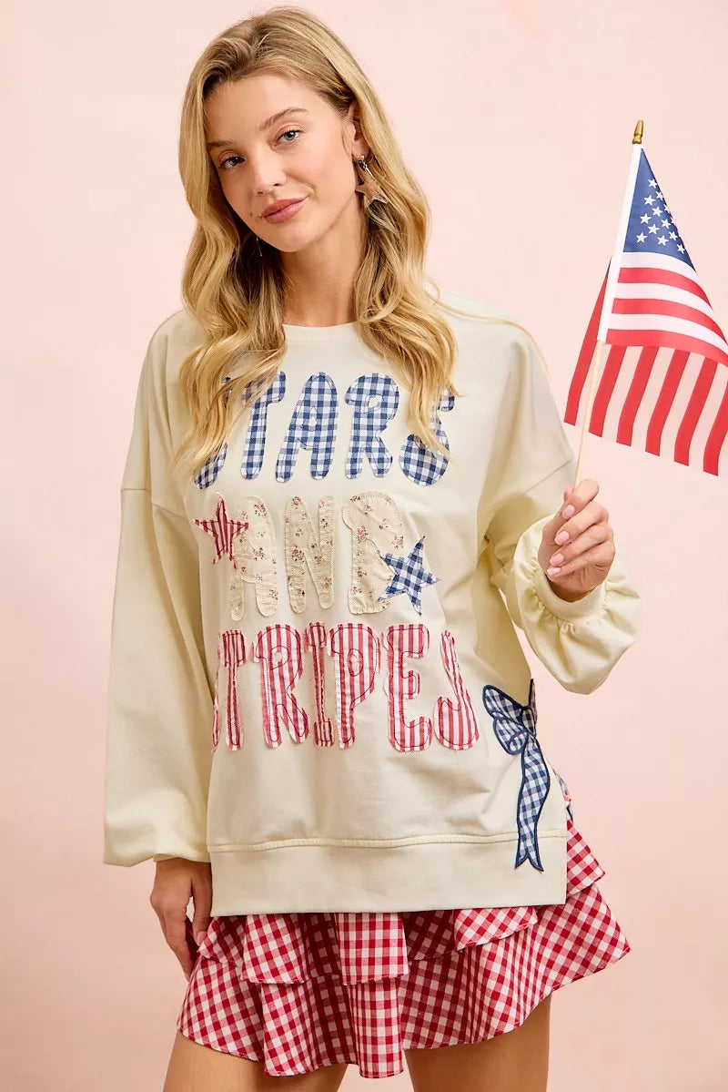 Cream sweatshirt with 4th of July stars and stripes patches from BiBi, featuring patriotic American flag designs.