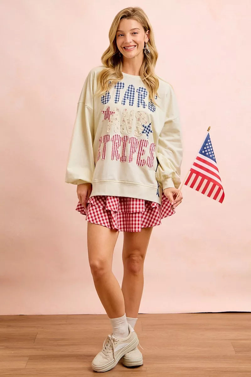 Cream BiBi 4th of July stars and stripes patches sweatshirt with patriotic flag designs, casual and cozy fit.
