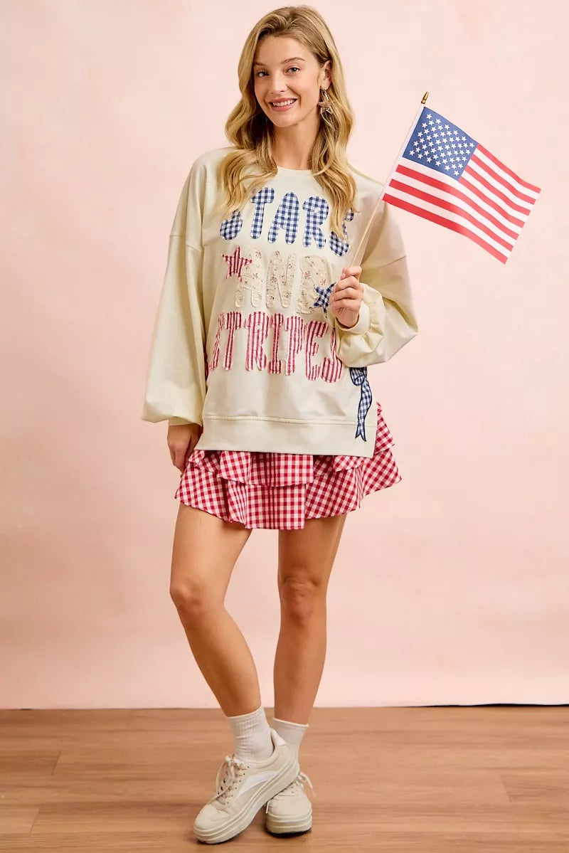 Cream sweatshirt with 4th of July stars and stripes patches from BiBi, featuring patriotic design and casual style.