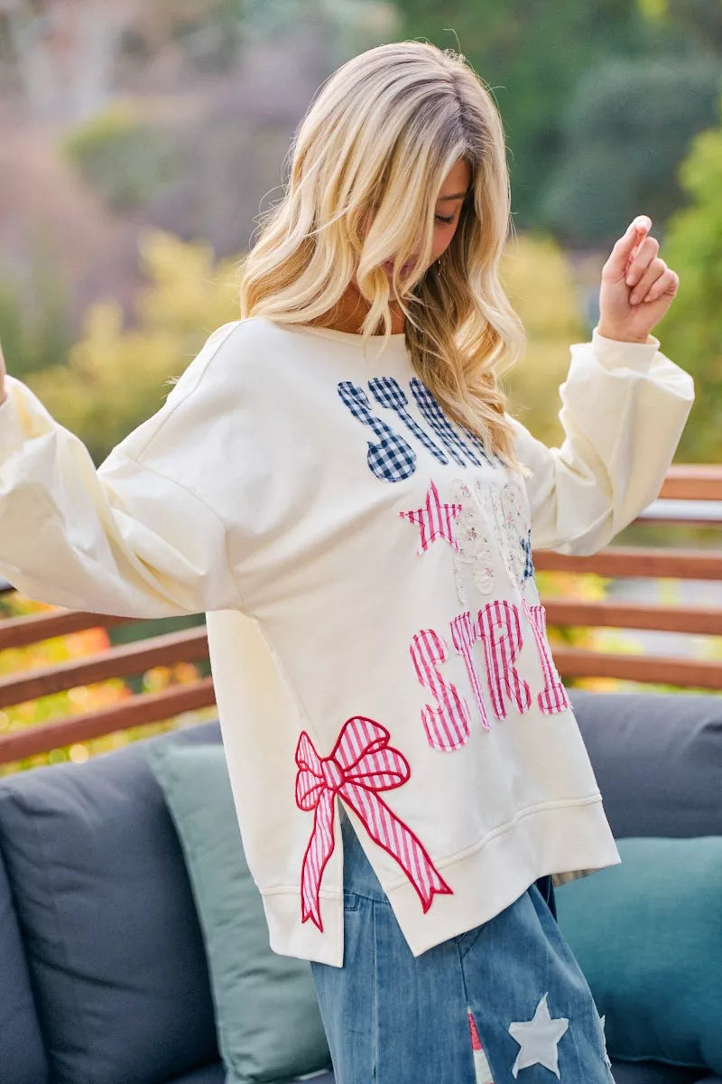 Cream sweatshirt with 4th of July stars and stripes patches from BiBi, featuring patriotic red, white, and blue design.