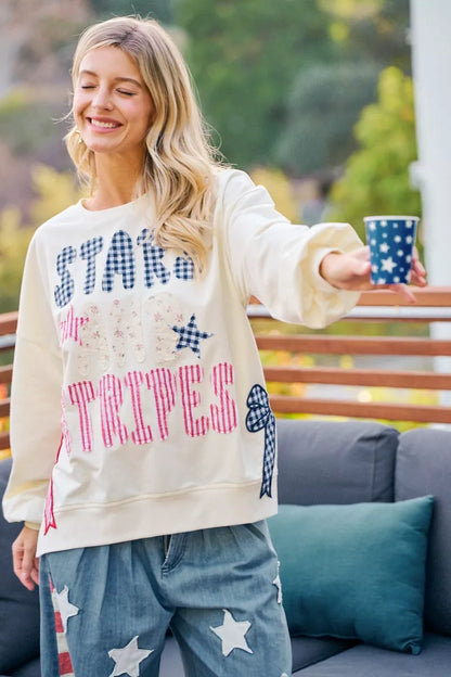 Cream sweatshirt by Trendsi featuring 4th of July stars and stripes patches, patriotic design, and casual fit.