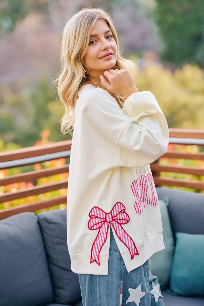 Cream sweatshirt with red, white, and blue stars and stripes patches for 4th of July, featuring the BiBi brand logo.
