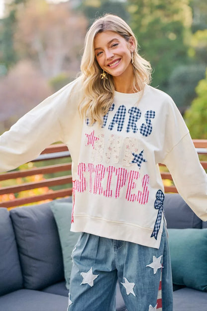 Cream sweatshirt by Trendsi featuring 4th of July stars and stripes patches for a patriotic, casual look.