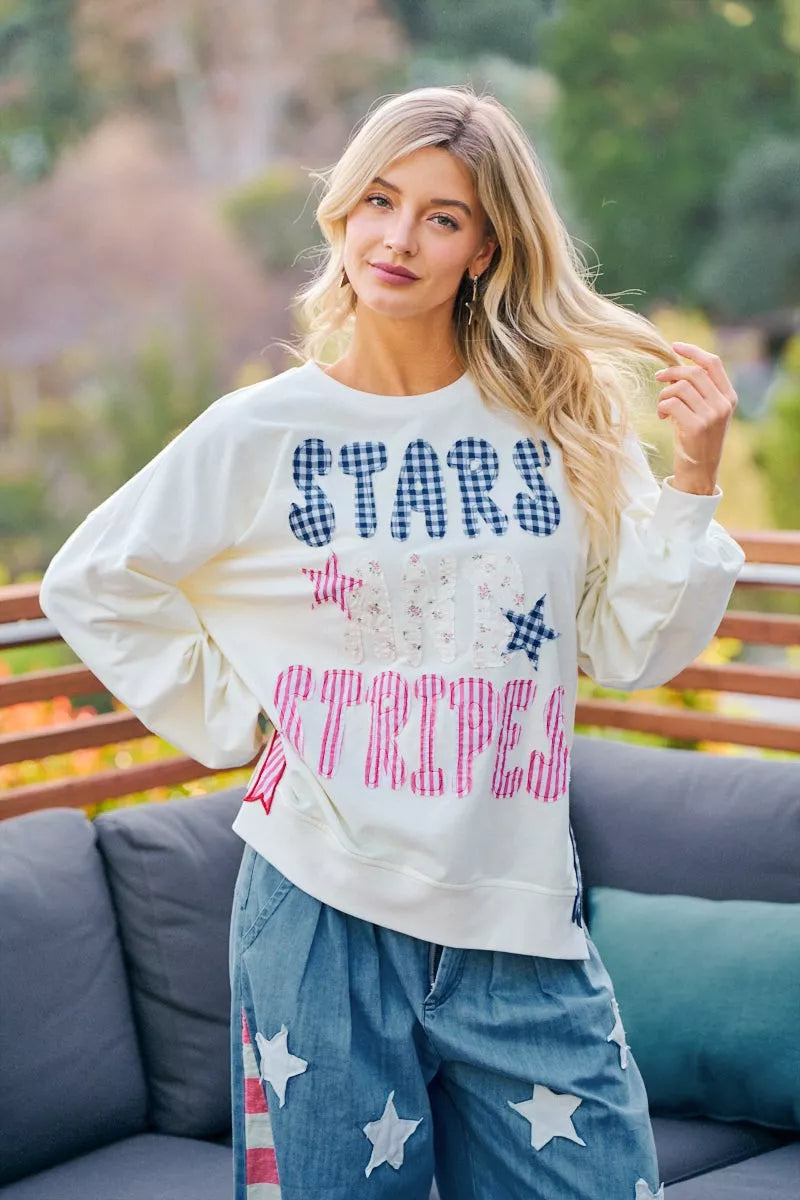 Cream sweatshirt with 4th of July stars and stripes patches, featuring patriotic red, white, and blue designs by Trendsi.