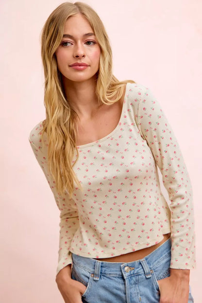 Cream floral printed long sleeve top made of spandex jersey from Trendsi, featuring a fitted design and vibrant floral pattern.