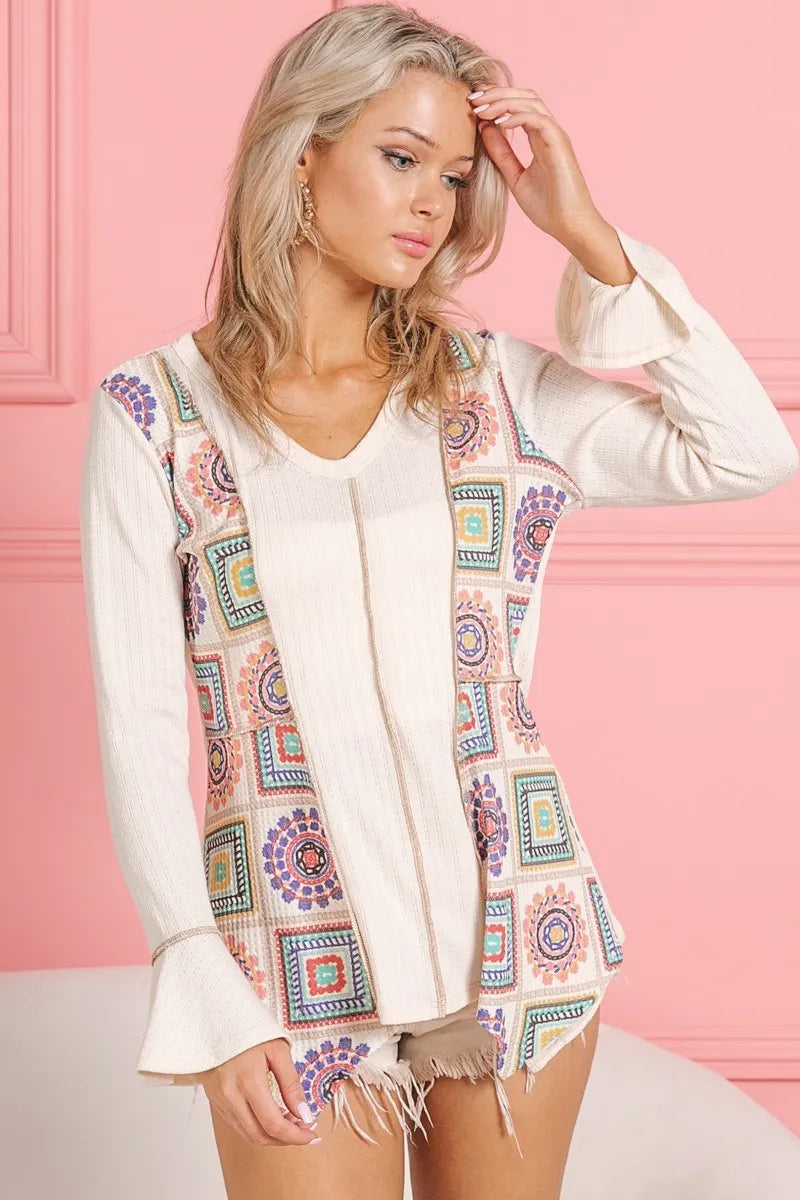Cream V-neck top with granny square print and contrast detailing, made by Trendsi, featuring Annie rib knit fabric.