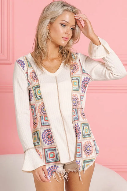 Cream V-neck top with granny square print and contrast detailing, made by Trendsi, featuring Annie rib knit fabric.