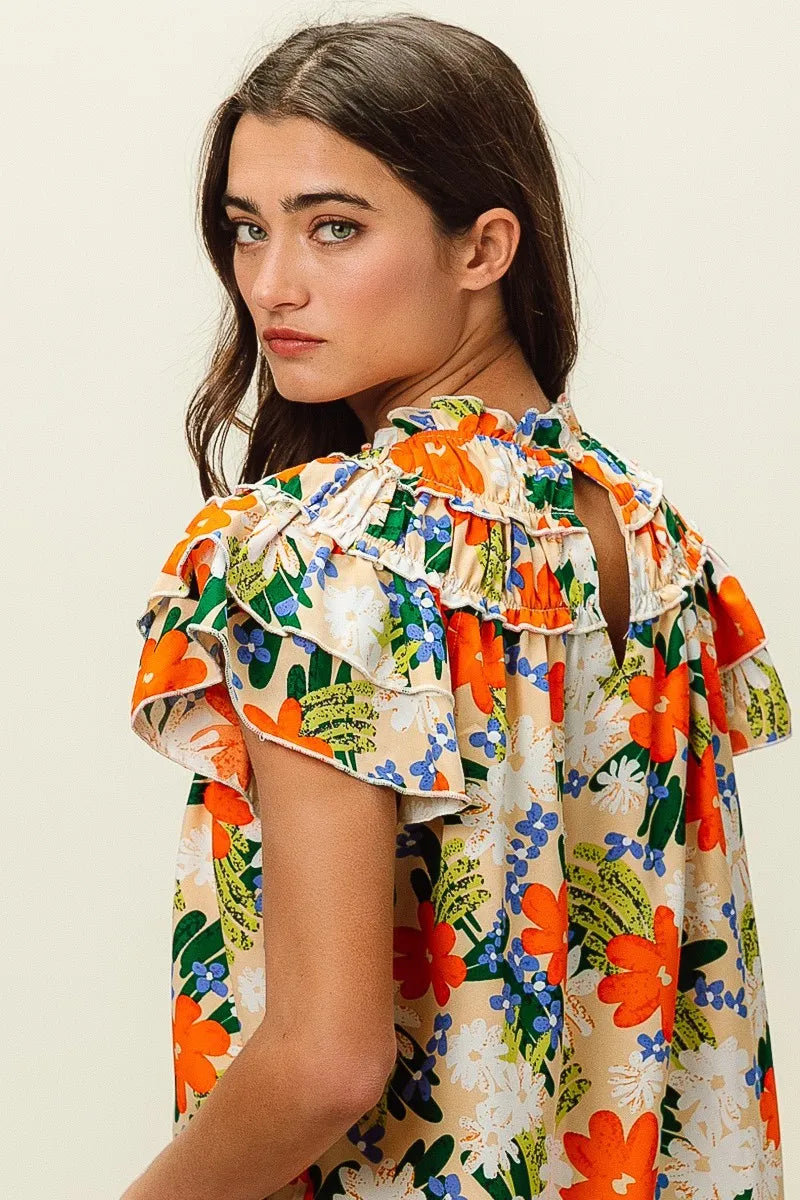Trendsi BiBi multi-color floral print woven top with lightweight fabric and long sleeves, styled on a white background.