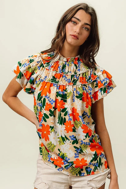 Multi-color floral print woven top by Trendsi featuring a stylish design and lightweight fabric.