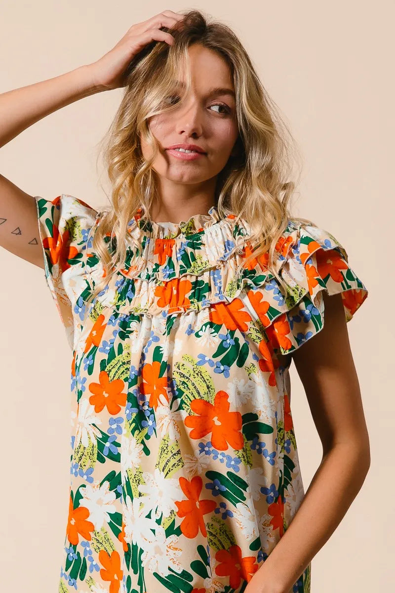 Multi-color floral print woven top by Trendsi, featuring a stylish design with vibrant floral patterns and a comfortable fit.