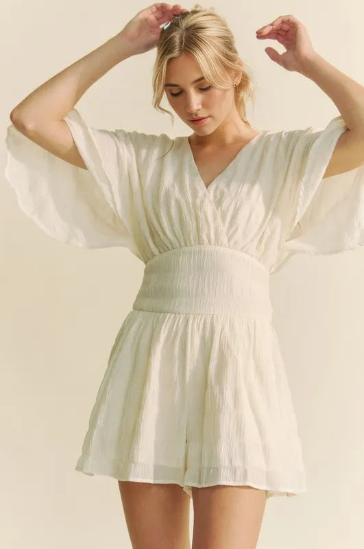 Cream Davi & Dani Batwing Sleeve Waist Belt Romper with relaxed fit and stylish design, perfect for casual or dressy occasions.