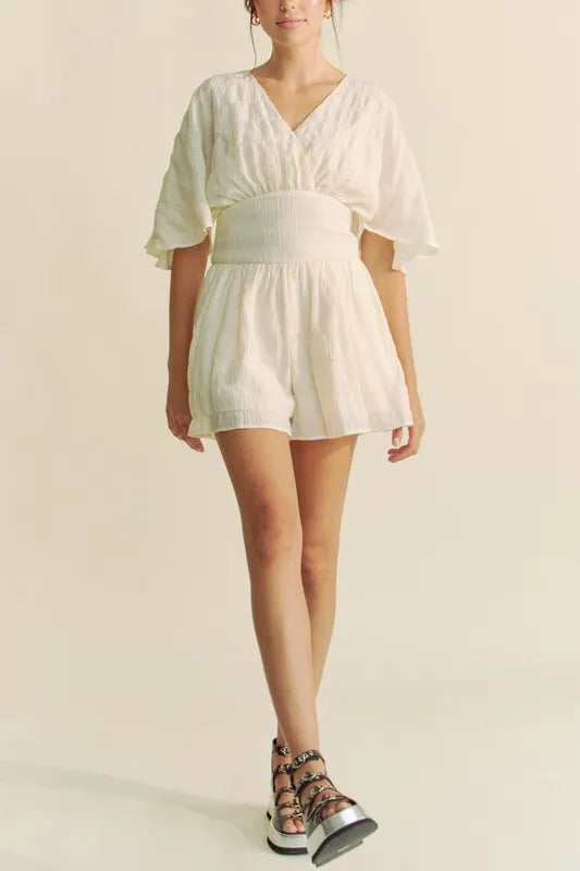Cream Davi & Dani Batwing Sleeve Waist Belt Romper with front tie and relaxed fit, stylish and comfortable for casual wear.