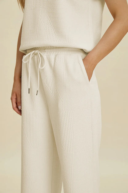 Cream-colored Trendsi Double Take short sleeve top and pants set with collared neck, full size, casual and stylish.