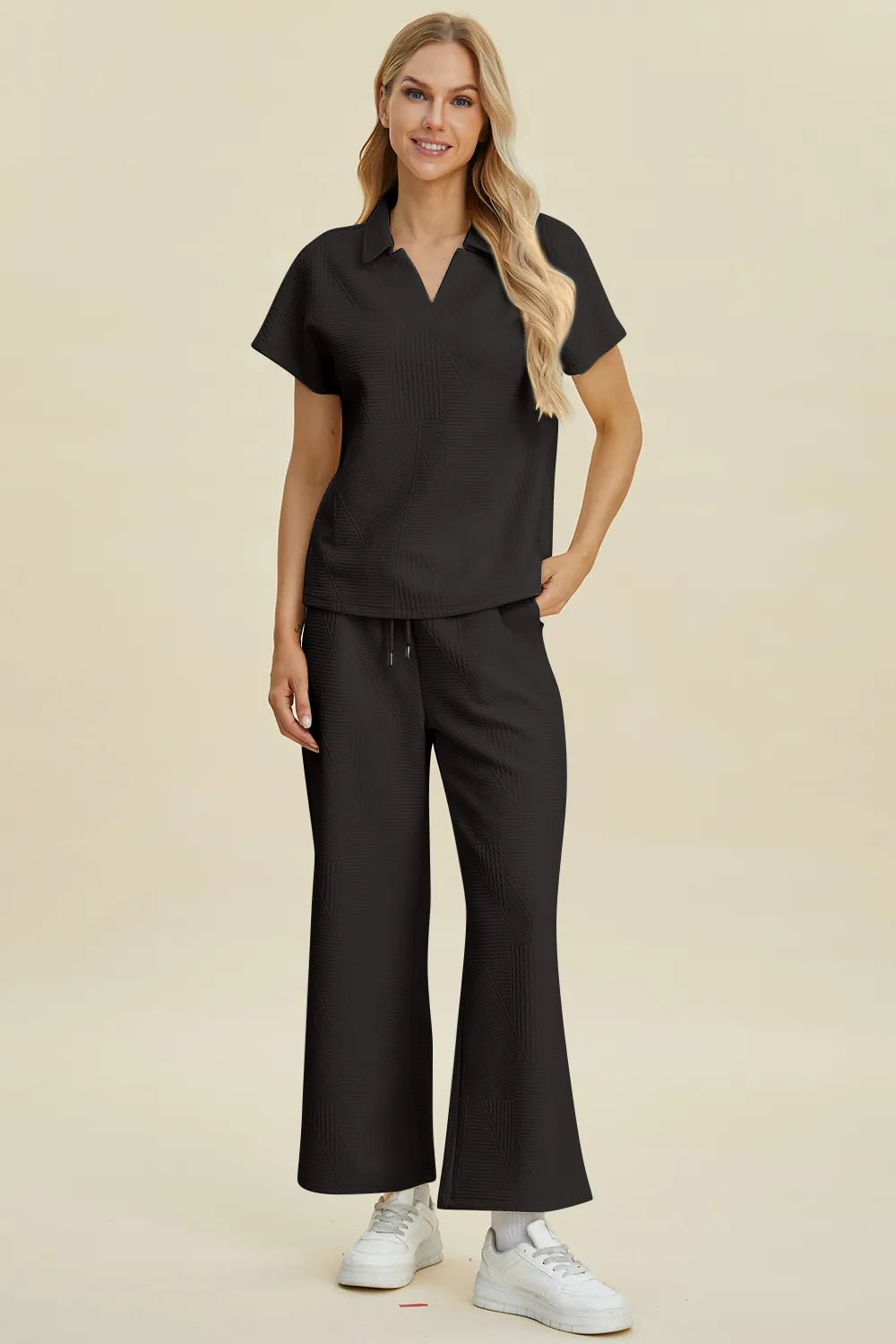 Cream-colored Trendsi Double Take short sleeve top and pants set with collared neck, perfect for casual wear.