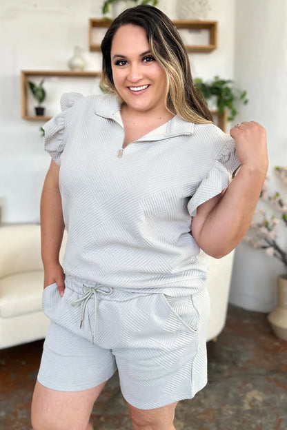 Cream-colored Trendsi Double Take texture flounce sleeve top with matching drawstring shorts set, casual and stylish summer outfit.