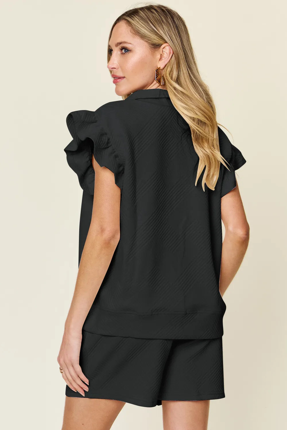 Cream-colored Trendsi double take set with textured flounce sleeve top and drawstring shorts, perfect for casual summer wear.