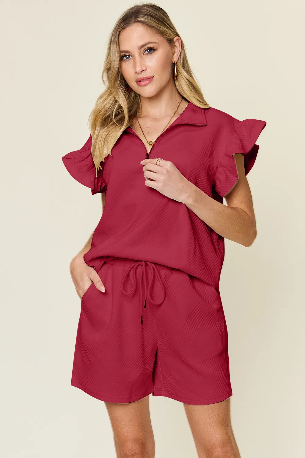Cream-colored Trendsi double take textured flounce sleeve top with matching drawstring shorts set, casual and stylish for everyday wear.