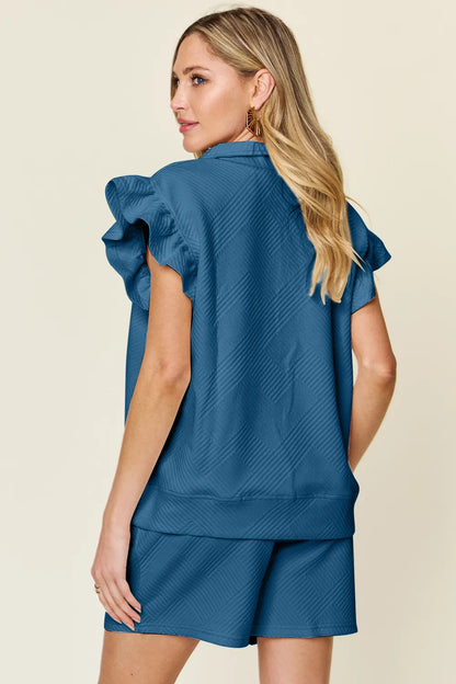 Cream-colored Trendsi double take textured top with flounce sleeves and matching drawstring shorts set on a model.