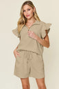 Cream-colored Trendsi double take texture flounce sleeve top with matching drawstring shorts set, casual and stylish for warm days.