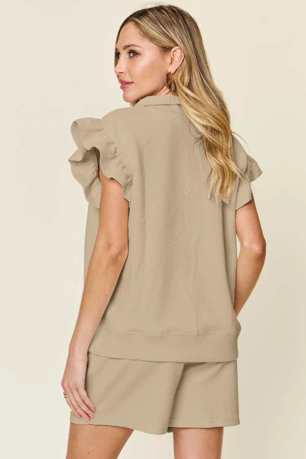 Cream-colored Trendsi double take full-size texture flounce sleeve top and drawstring shorts set, casual and stylish for warm weather.
