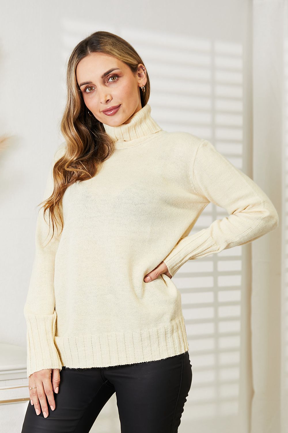 Cream Heimish long sleeve turtleneck sweater with side slit, available in size S, featuring a cozy, stylish design for casual wear.
