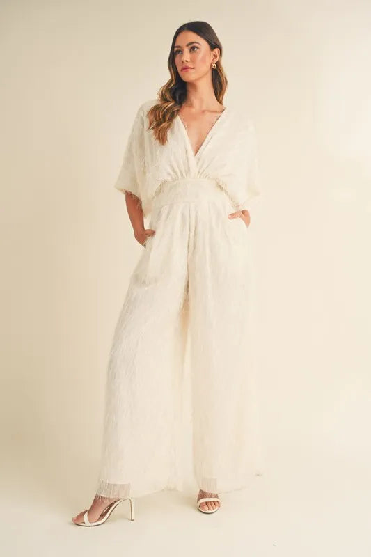 Cream MABLE Fluffy Deep V Neck Wide Leg Jumpsuit by Trendsi, featuring a soft, textured fabric and stylish wide-leg design.
