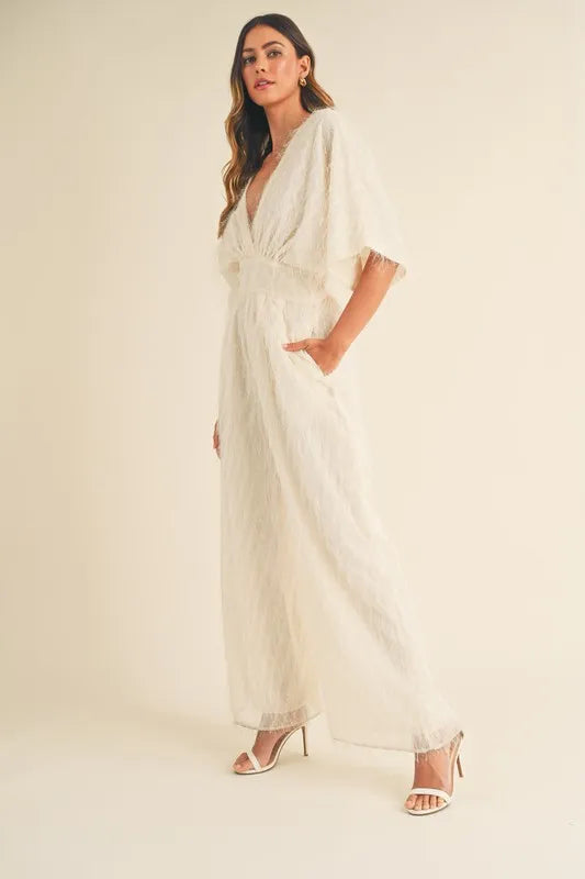 Cream MABLE Fluffy Deep V Neck Wide Leg Jumpsuit by Trendsi, featuring a soft textured fabric and stylish deep V neckline.