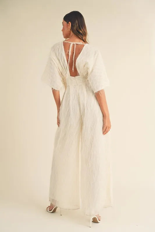Cream MABLE Fluffy Deep V Neck Wide Leg Jumpsuit by Trendsi, showing the soft textured fabric and deep V neckline.