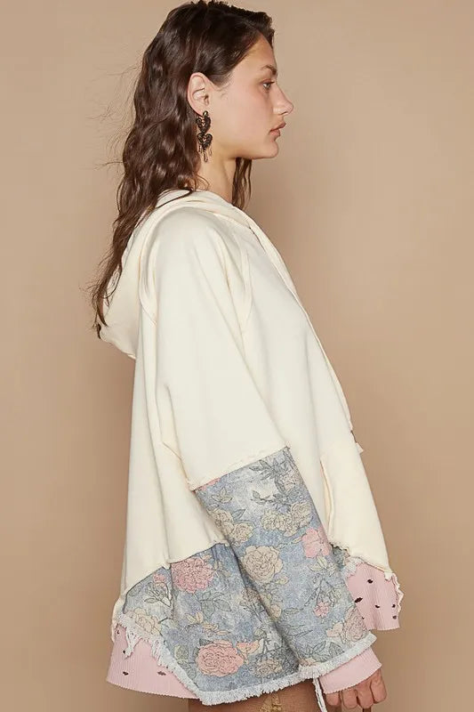 Cream POL floral patchwork distressed drawstring hoodie from Trendsi featuring floral designs and casual comfort.