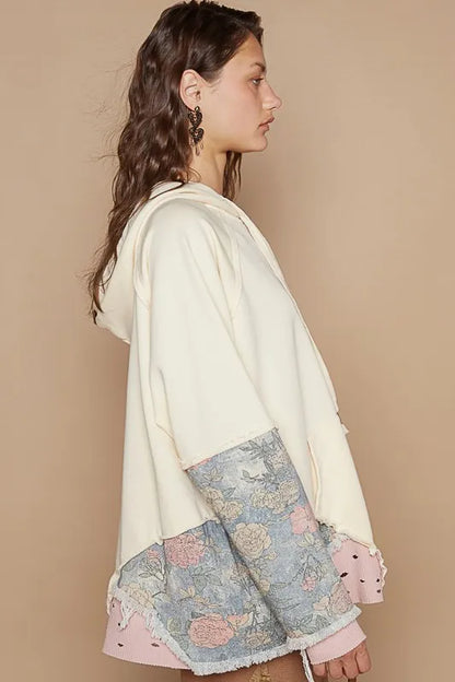 Cream POL floral patchwork distressed drawstring hoodie from Trendsi featuring floral designs and casual comfort.
