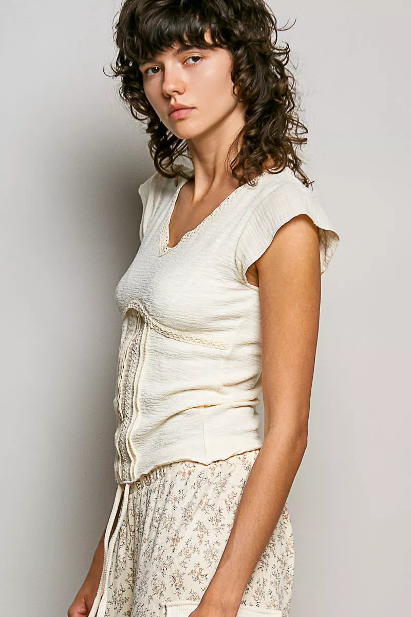 Cream V-neck lightweight textured knit top with short sleeves and lace trim, by Trendsi.