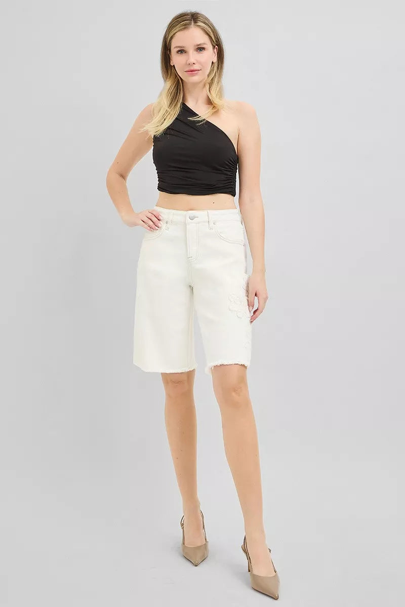 Cream-colored RISEN relaxed floral embroidered Bermuda denim shorts with a slouchy fit, styled for casual comfort.