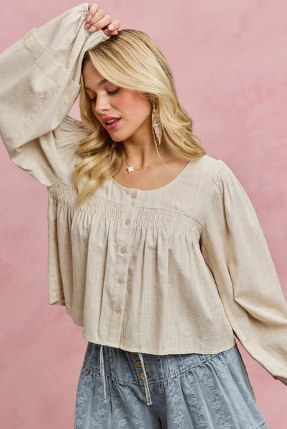Cream linen-blend woven long sleeve top with smocking detail, by Trendsi, featuring a relaxed, stylish design.