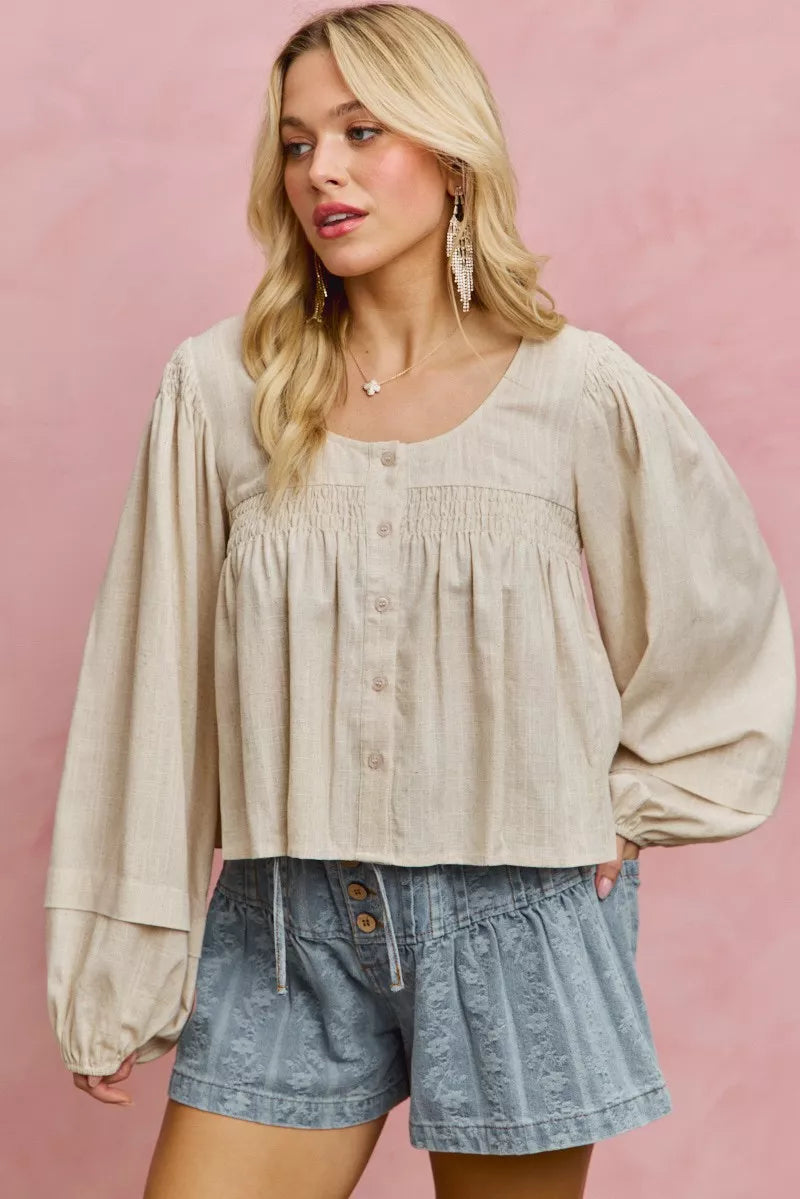 Cream linen-blend woven long sleeve top with smocking detail, stylish and comfortable for casual wear.