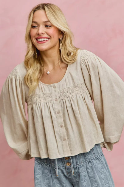 Cream linen blend woven long sleeve top with smocking detail from SO ME by Trendsi, featuring a relaxed fit and textured fabric.