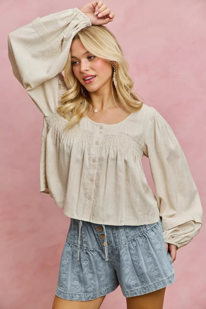 Cream linen blend woven long sleeve top with smocking detail from SO ME by Trendsi, featuring a relaxed fit and elegant design.