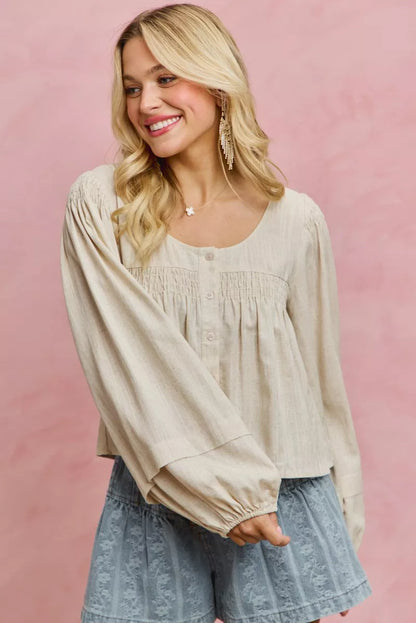 Cream linen blend woven long sleeve top with smocking detail from SO ME by Trendsi, featuring a relaxed fit and textured fabric.