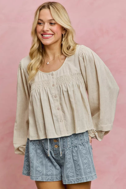 Cream linen blend woven long sleeve top with smocking detail, from Trendsi, featuring a relaxed fit and stylish design.