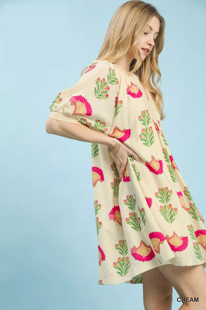 Cream Umgee abstract print mini dress featuring a relaxed fit and stylish design, perfect for casual or summer wear.