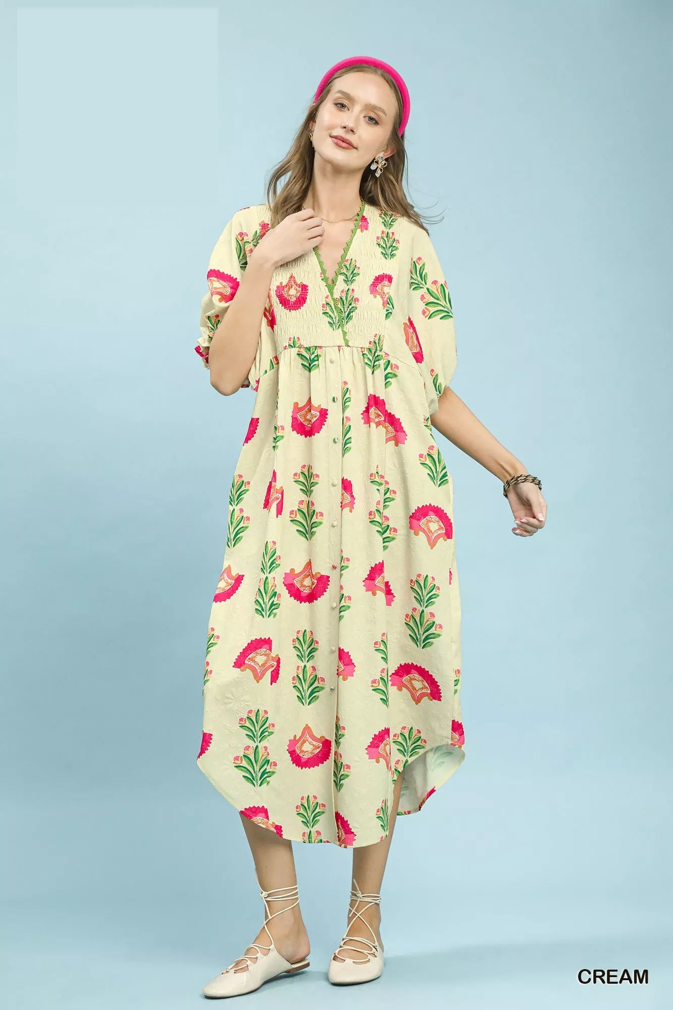 Cream Umgee abstract print V-neck midi dress with short sleeves, featuring a stylish and comfortable flowy design.