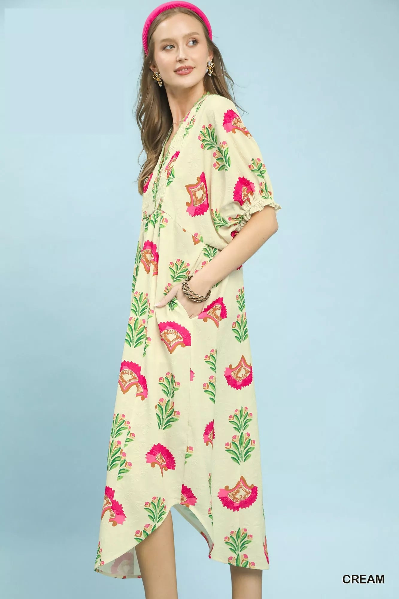Cream Umgee abstract print V-neck midi dress with short sleeves and relaxed fit, perfect for casual or semi-formal wear.