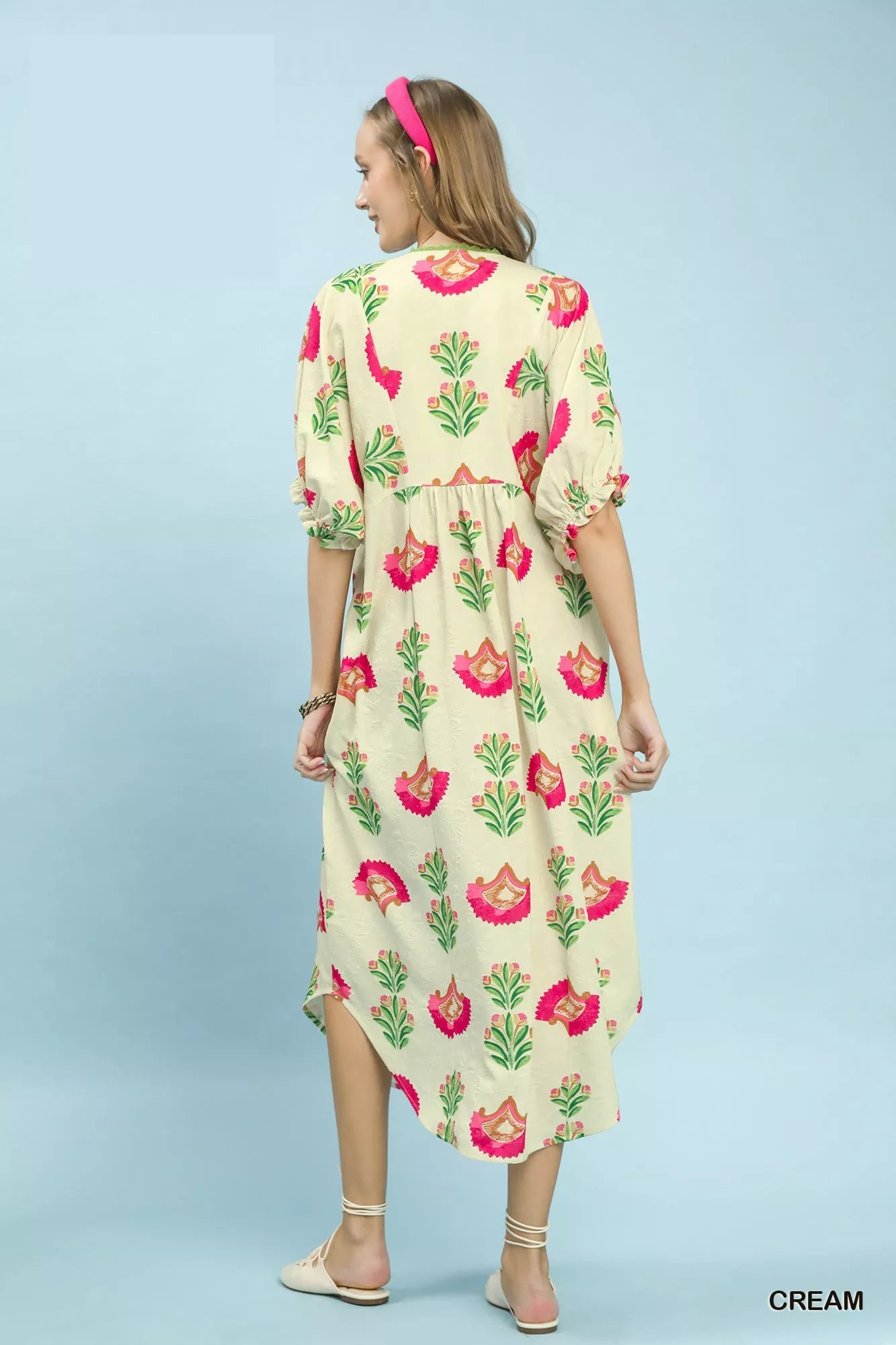 Cream Umgee abstract print V-neck midi dress from Trendsi, featuring a stylish flowy silhouette and mid-length design.