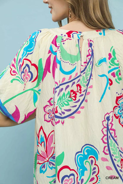 Cream Umgee border print puff sleeve blouse by Trendsi featuring a flowy silhouette and ruffled cuffs.