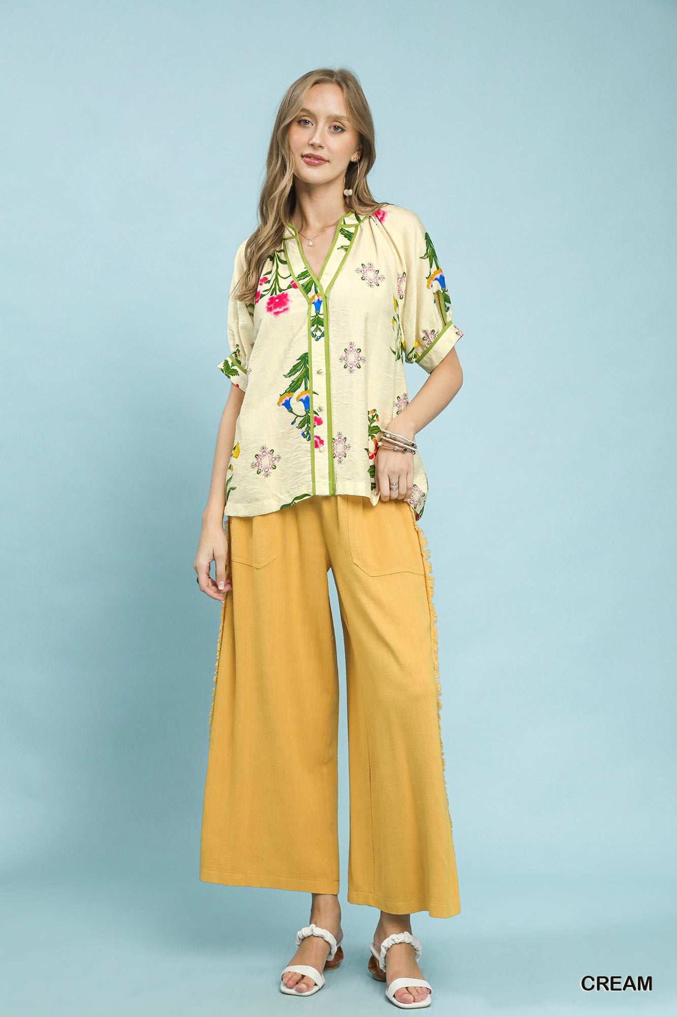 Cream Umgee botanical print contrast trim button blouse with long sleeves and button-front closure, stylish and lightweight.