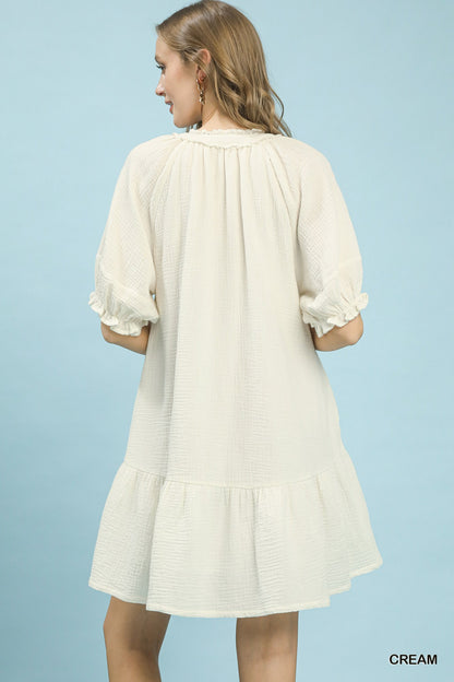 Cream Umgee cotton gauze mini dress from Trendsi, featuring a relaxed fit and lightweight, breathable fabric perfect for casual wear.
