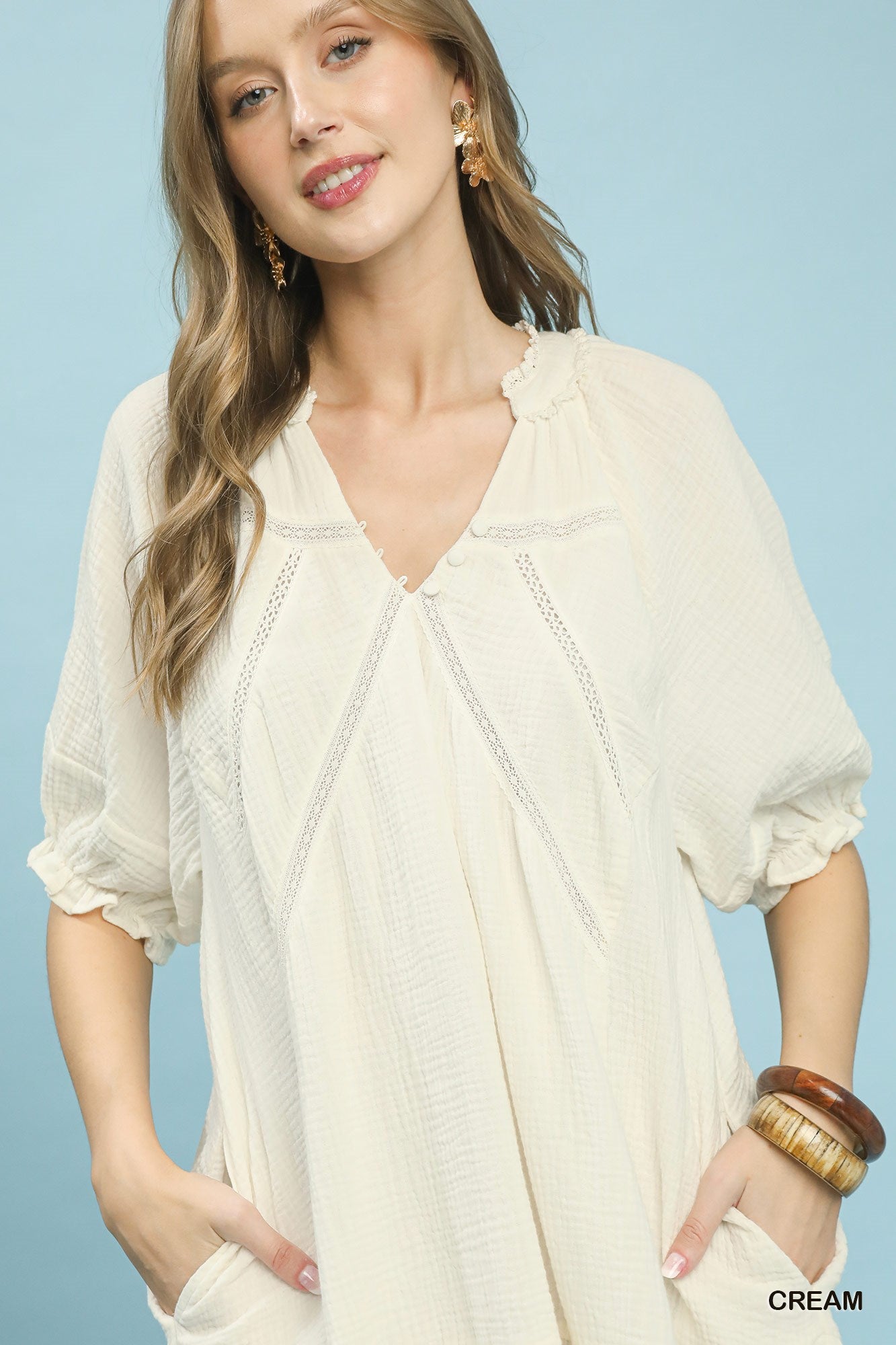 Cream Umgee cotton gauze mini dress by Trendsi, featuring lightweight, breathable fabric and a relaxed fit, perfect for casual wear.